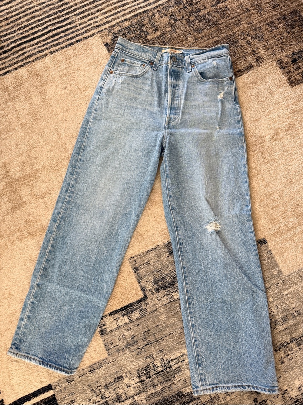 Levi’s Light Wash Straight Leg Jeans with Distressed Detail
